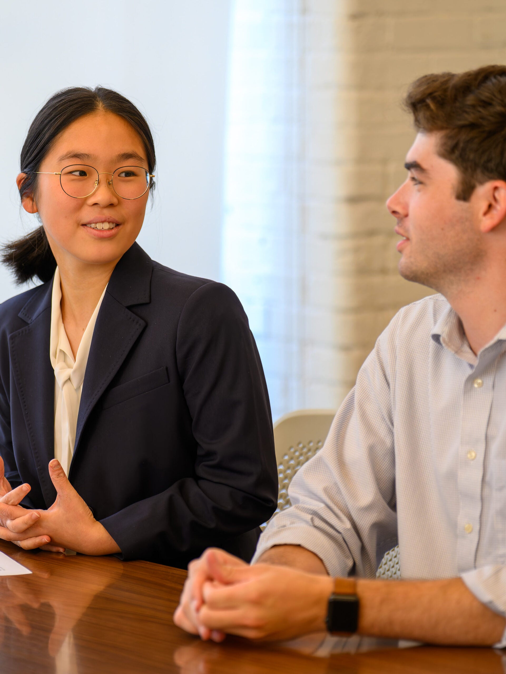 Students talking at desk