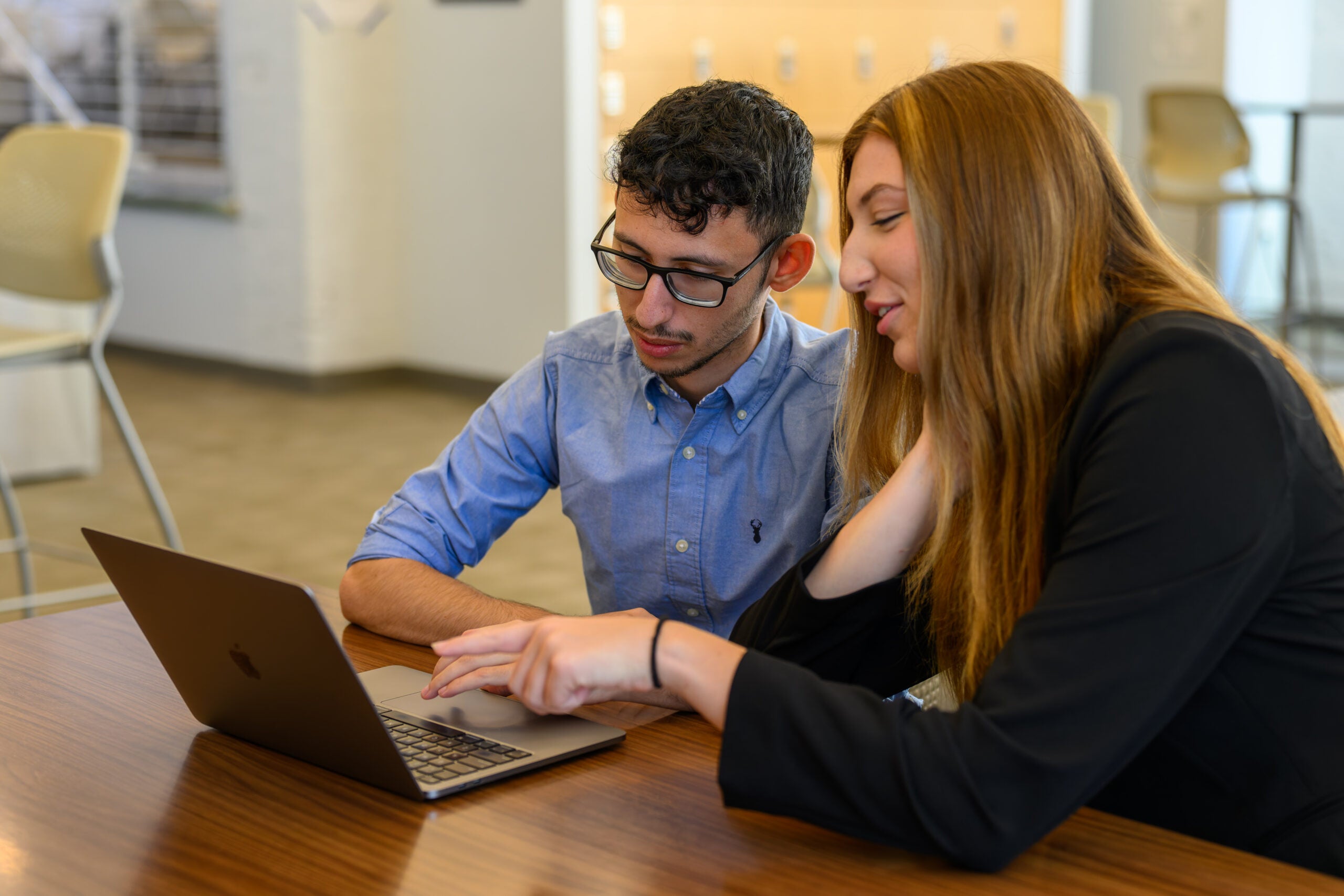 Students looking at a computer