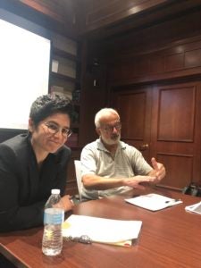 Conflict Resolution Program Director Dr. Desha Girod asks Scott Guggenheim questions during the Fireside chat.