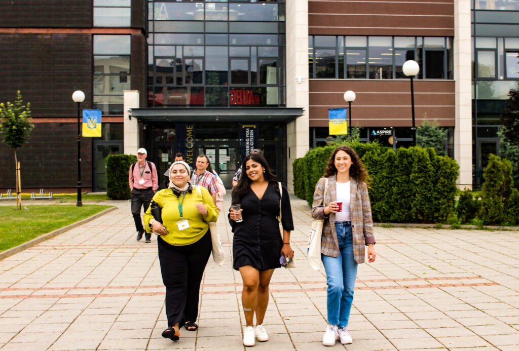 Students walking outside of academic building