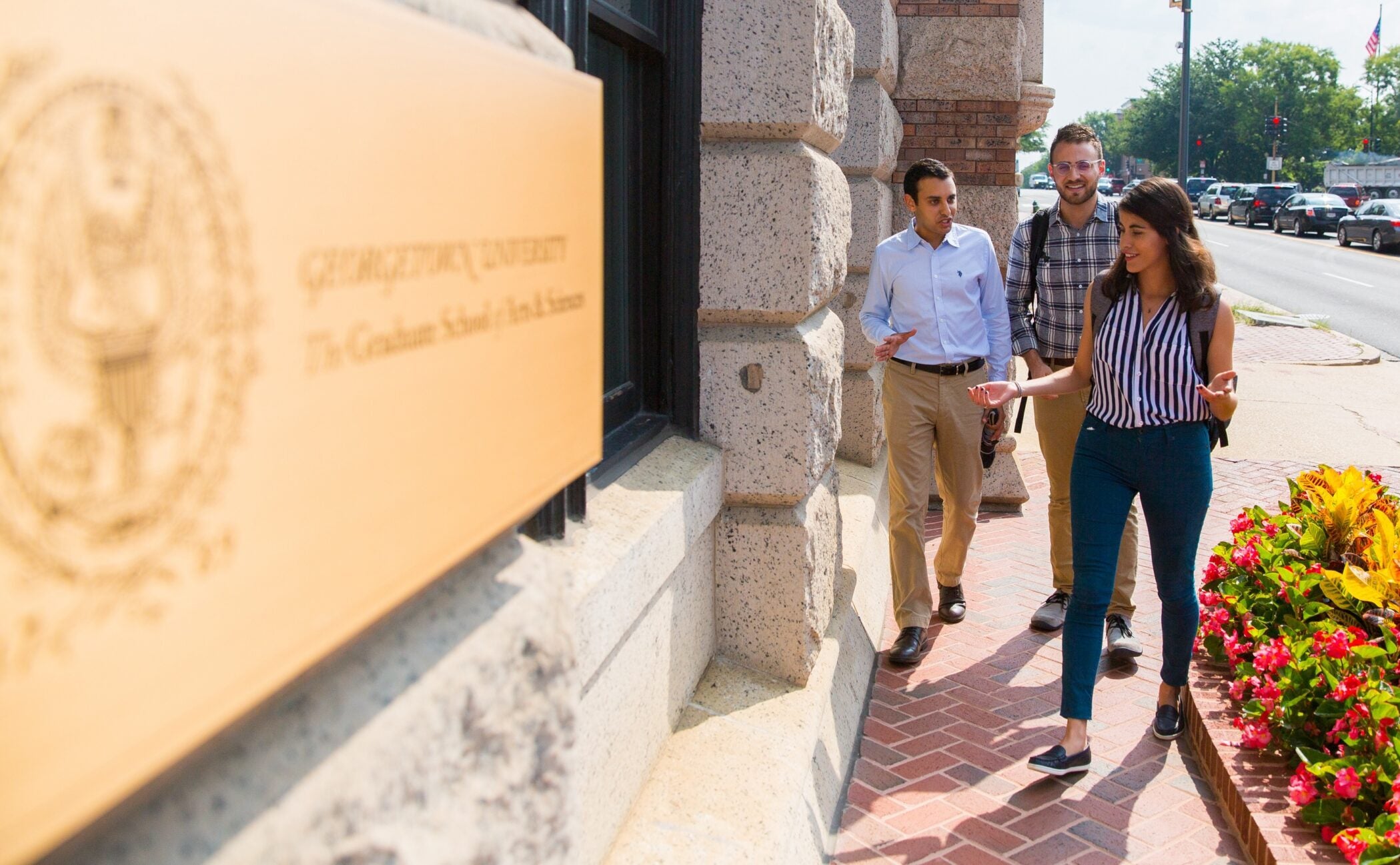 students walking to class outside of the graduate school