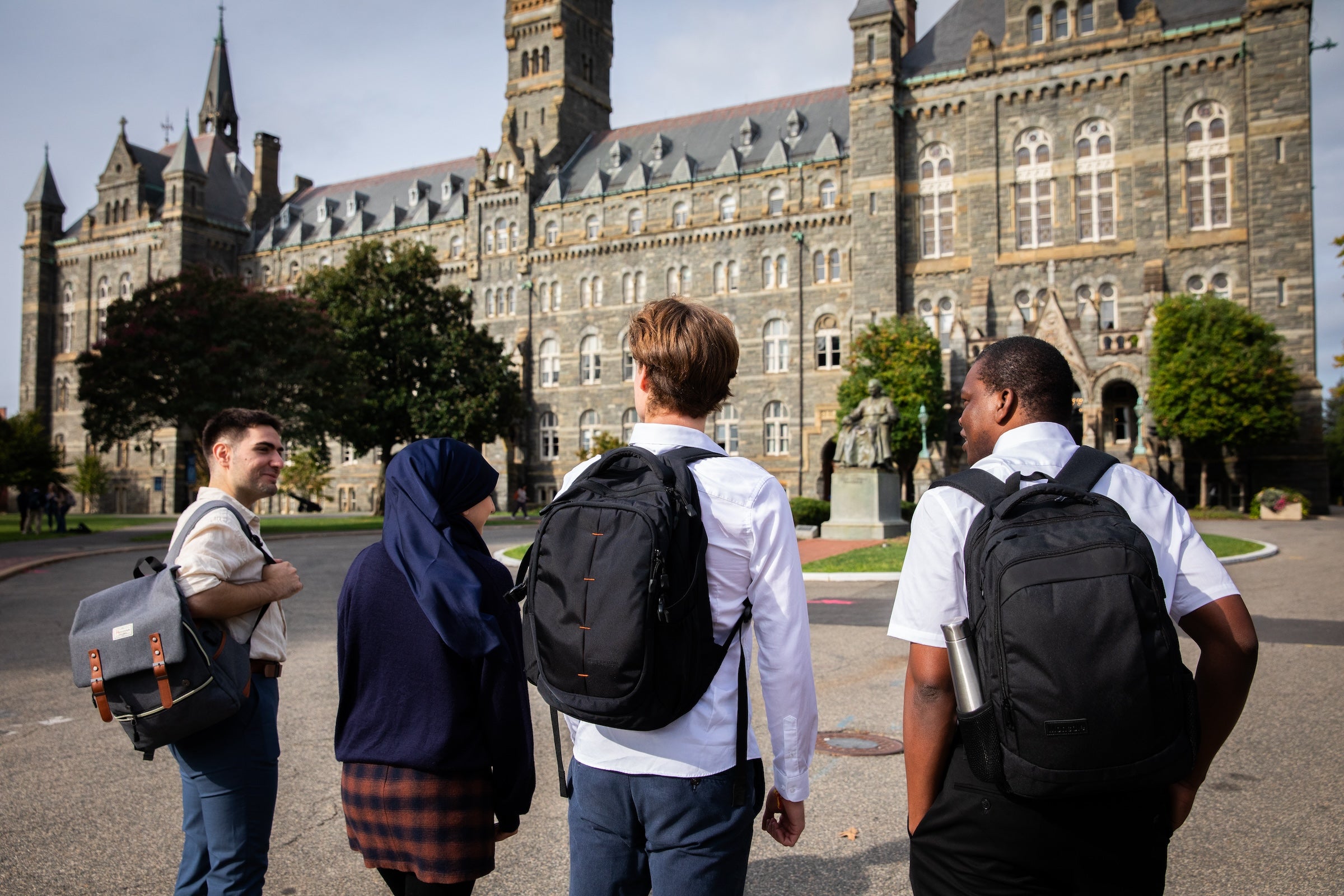 Students walking together toward Healy Hall.