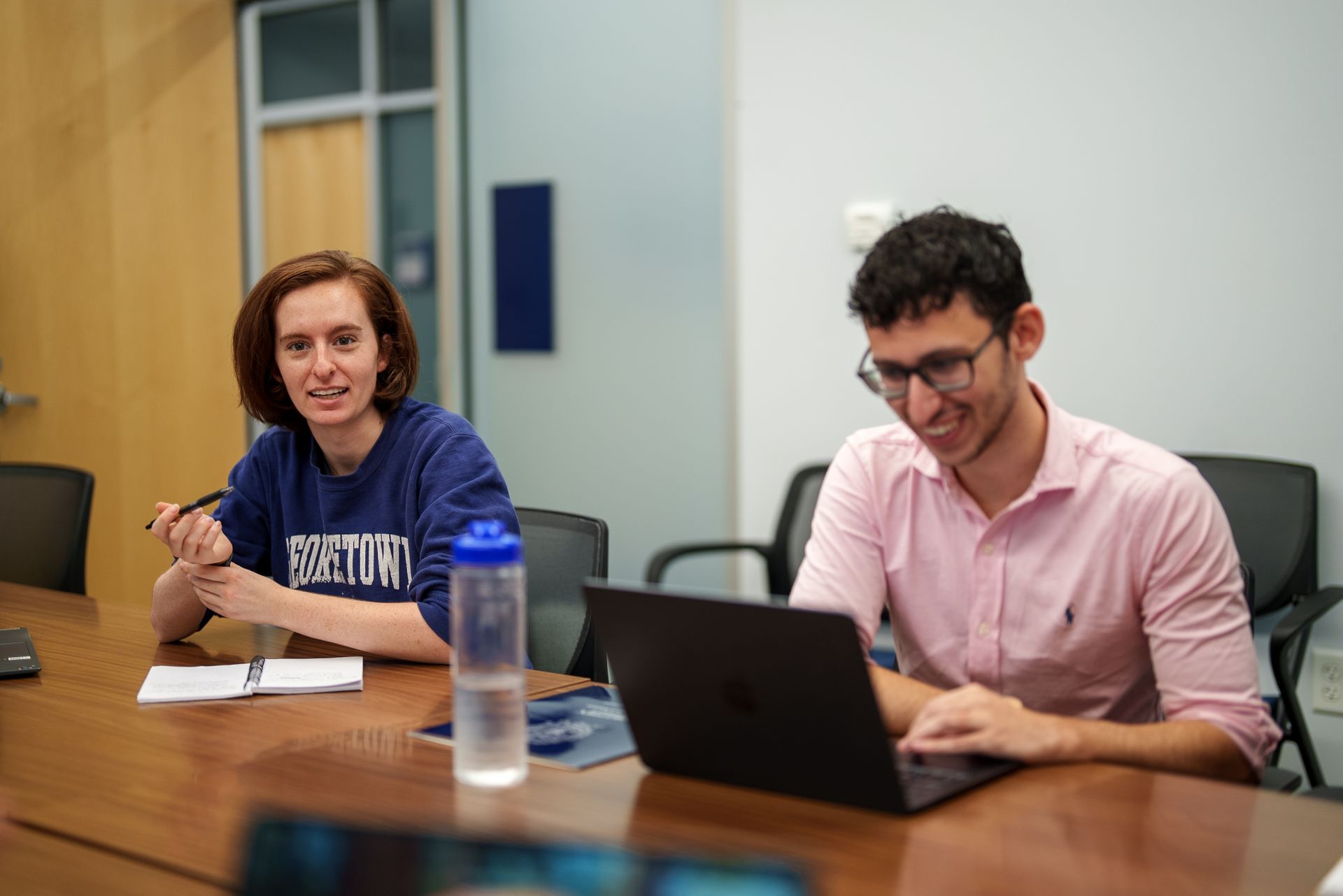 Two students together in class.