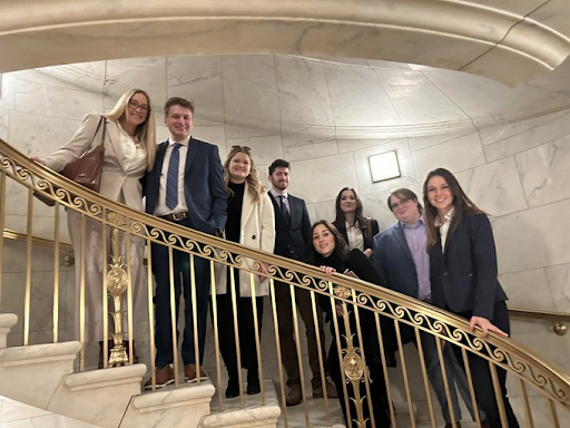 MA in American Government students standing on staircase at the Supreme Court